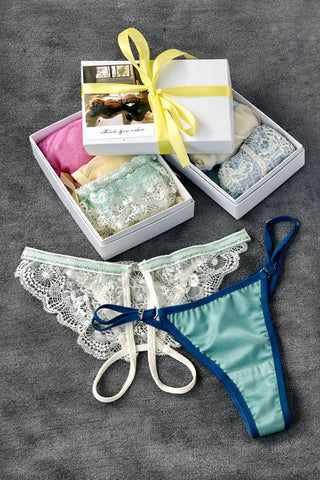 Secret Box NANIKA з жіночою білизною — мереживні трусики та подарункові коробки у різних кольорах.